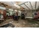 Spacious garage interior filled with equipment, tools, and ample storage solutions at 7733 Skyline Dr, Sherrills Ford, NC 28673