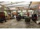 A large garage interior featuring motorcyle, workbench, ample storage and various tools at 7733 Skyline Dr, Sherrills Ford, NC 28673