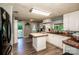 Well-lit kitchen with white cabinets, butcher block countertops, stainless steel appliances, and tile backsplash at 7733 Skyline Dr, Sherrills Ford, NC 28673