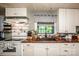 Bright and functional kitchen with white cabinets, butcher block counters, and stainless steel sink at 7733 Skyline Dr, Sherrills Ford, NC 28673
