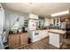 Bright kitchen featuring white cabinets, butcher block counters, wood floors, and modern appliances at 7733 Skyline Dr, Sherrills Ford, NC 28673