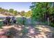 Property entrance featuring decorative stone statues and a metal gate leading to the home at 7733 Skyline Dr, Sherrills Ford, NC 28673