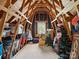 Spacious unfinished attic with wooden beams and a window, perfect for storage or future expansion at 8128 Sealey Ct, Charlotte, NC 28277