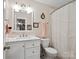 Nicely renovated bathroom with white cabinets, updated fixtures, and a shower/tub combination at 8128 Sealey Ct, Charlotte, NC 28277