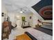 Large bedroom featuring ceiling fan, ensuite bath, and a treadmill for exercising at 8128 Sealey Ct, Charlotte, NC 28277