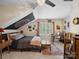 Vaulted bedroom offering natural light, desk and a ceiling fan at 8128 Sealey Ct, Charlotte, NC 28277