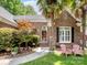 Welcoming entryway with decorative landscaping and charming pink chairs on the front lawn at 8128 Sealey Ct, Charlotte, NC 28277