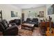 Cozy living room with comfortable seating, ample natural light, and a beautiful area rug at 8128 Sealey Ct, Charlotte, NC 28277