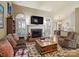 Open living space with fireplace, lots of natural light, and view into eat-in kitchen at 8128 Sealey Ct, Charlotte, NC 28277