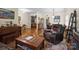 Spacious living room featuring hardwood floors and ample seating, perfect for relaxation at 8128 Sealey Ct, Charlotte, NC 28277