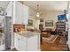 Open living area with hardwood floors and lots of wall art at 8128 Sealey Ct, Charlotte, NC 28277
