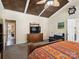 Vaulted wood-plank ceiling, walk-in closet, and bathroom entrance provide a charming primary suite at 8128 Sealey Ct, Charlotte, NC 28277