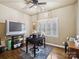 Office with a large window, wood floors and a desk at 8128 Sealey Ct, Charlotte, NC 28277