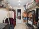 Carpeted walk-in closet with white wire shelving for clothes and storage at 8128 Sealey Ct, Charlotte, NC 28277