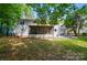 Expansive backyard featuring a screened porch and patio, ideal for outdoor entertaining and relaxation at 8501 Flanagan Ct, Huntersville, NC 28078