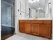 Bathroom features a wood vanity with a white countertop, square tile flooring and neutral paint at 8501 Flanagan Ct, Huntersville, NC 28078