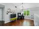 Spare bedroom with a vaulted ceiling, hardwood floors, a ceiling fan and a well-lit desk at 8501 Flanagan Ct, Huntersville, NC 28078