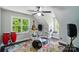 Attic conversion bedroom featuring large windows, ceiling fan and bright lighting at 8501 Flanagan Ct, Huntersville, NC 28078
