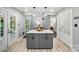 Kitchen island with cabinets and seating area for casual dining at 8501 Flanagan Ct, Huntersville, NC 28078