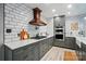 Updated kitchen with gray cabinetry, quartz counters, and stainless steel appliances at 8501 Flanagan Ct, Huntersville, NC 28078