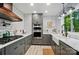 Modern kitchen with stainless steel appliances, stylish backsplash, and a window at 8501 Flanagan Ct, Huntersville, NC 28078