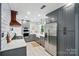Updated kitchen features stainless steel appliances, subway tile backsplash, and stylish gray cabinets at 8501 Flanagan Ct, Huntersville, NC 28078
