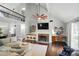 Bright living room features a brick fireplace, built-ins and vaulted ceiling at 8501 Flanagan Ct, Huntersville, NC 28078