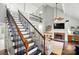 Elegant staircase showcasing wrought iron spindles and hardwood steps at 8501 Flanagan Ct, Huntersville, NC 28078