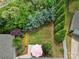 Aerial view of a private backyard featuring a patio area with lounge seating surrounded by lush greenery at 8702 Aspinwall Dr, Charlotte, NC 28216