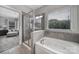 Relaxing bathroom with separate shower and large tub perfect for unwinding after a long day at 8702 Aspinwall Dr, Charlotte, NC 28216