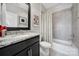 Clean bathroom with a shower-tub combination, granite countertop vanity and neutral decor at 8702 Aspinwall Dr, Charlotte, NC 28216