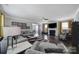 Expansive living room layout featuring hardwood floors, a fireplace, and elegant decor at 8702 Aspinwall Dr, Charlotte, NC 28216