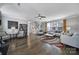 Spacious living room featuring hardwood floors, modern furnishings, and ample natural light at 8702 Aspinwall Dr, Charlotte, NC 28216