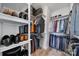 Well-organized walk-in closet with ample shelving and hanging space for clothing and accessories at 8702 Aspinwall Dr, Charlotte, NC 28216