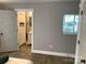 View from a bedroom into an ensuite bathroom, showcasing the convenient layout and design at 913 Winchester Ave, Monroe, NC 28110