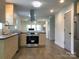 Modern kitchen with stainless steel appliances and stylish cabinets, part of an open layout at 913 Winchester Ave, Monroe, NC 28110