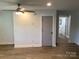Light and airy living room with wood-look floors, and neutral colors at 913 Winchester Ave, Monroe, NC 28110