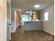 Open-concept living space showcasing stylish flooring, with modern kitchen view at 913 Winchester Ave, Monroe, NC 28110