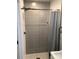 Newly renovated shower with gray tile and a black shower head, offering a modern and stylish design at 913 Winchester Ave, Monroe, NC 28110