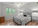 Bright bedroom with natural light, hardwood floors, and a neutral color scheme; airy and serene at 9214 Arbourgate Meadows Ln, Charlotte, NC 28277