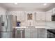 Bright kitchen featuring stainless steel appliances, sleek countertops, and ample cabinets at 9214 Arbourgate Meadows Ln, Charlotte, NC 28277