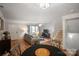 Inviting living room with hardwood floors, cozy seating, and a staircase leading to upper levels at 9214 Arbourgate Meadows Ln, Charlotte, NC 28277