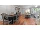 Open floor plan with hardwood floors, a dining area, and comfortable living space at 9214 Arbourgate Meadows Ln, Charlotte, NC 28277