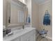 Well-appointed bathroom featuring a vanity with a large mirror and stylish decor at 1021 Westbury Dr, Matthews, NC 28104