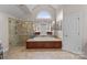 Bright primary bathroom with tiled floors, soaking tub, and glass enclosed shower at 1021 Westbury Dr, Matthews, NC 28104
