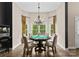 Bright game room featuring a game table with seating for six, a chandelier, and a popcorn machine at 1021 Westbury Dr, Matthews, NC 28104