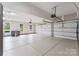 Spacious three-car garage with epoxy flooring, built in storage, and bright lighting at 1021 Westbury Dr, Matthews, NC 28104