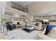 Open concept living room with hardwood floors and a view of the staircase at 1021 Westbury Dr, Matthews, NC 28104