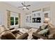 Cozy living room with built-in shelving, large window and comfortable leather seating at 1021 Westbury Dr, Matthews, NC 28104
