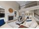 Comfortable living room with a fireplace, vaulted ceilings, and hardwood floors at 1021 Westbury Dr, Matthews, NC 28104
